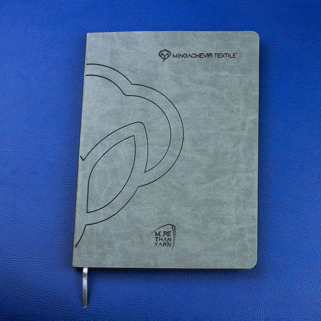 Softcover, gray faux leather, thermal printing, full color printing on inner pages, rounded corners, calendar pad